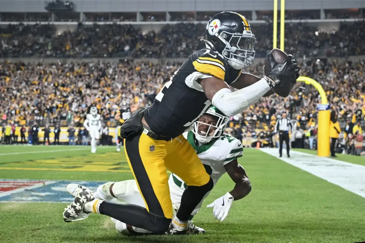 Football Player Catches Pass in End Zone