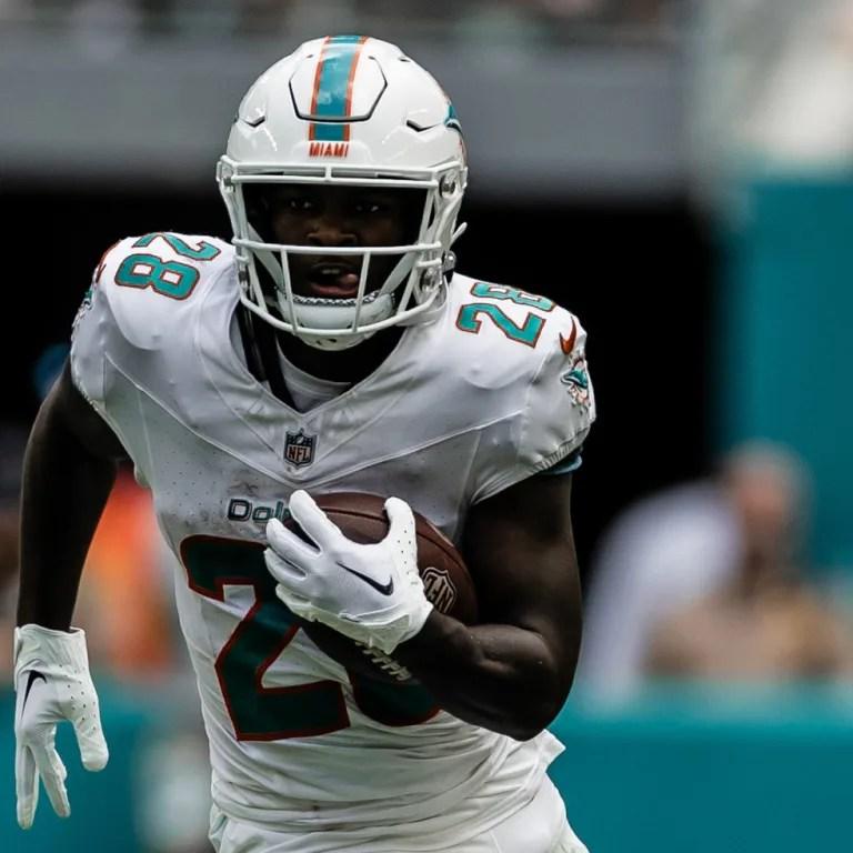 Miami Dolphins Player Running with Football